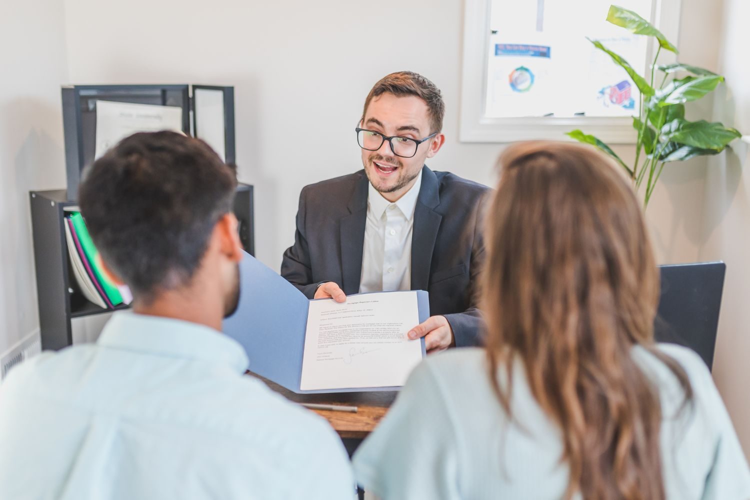 Realtor discussing closing process with South Florida title company representative Realtor discussing closing process with South Florida title company representative<br />